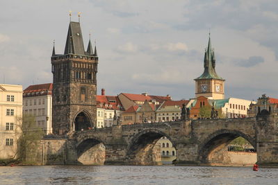 Charles  bridge over vltava river against buildings of praque,czech,view from river