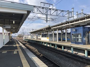 Train on railroad station platform against sky