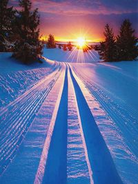 Railroad tracks against sky during winter