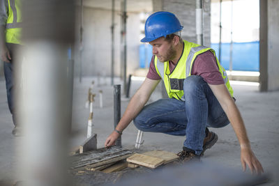 Construction worker on construction site checking work