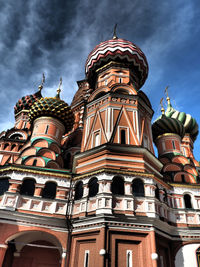 Low angle view of church against cloudy sky