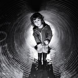 Full length portrait of girl standing outdoors