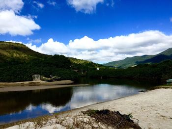 Scenic view of lake against mountain range