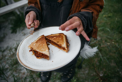 Midsection of man holding food