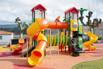 View of playground against cloudy sky