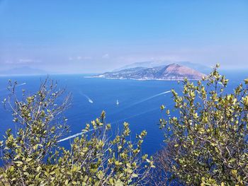 Scenic view of sea against blue sky