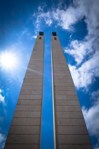 Low angle view of building against sky on sunny day