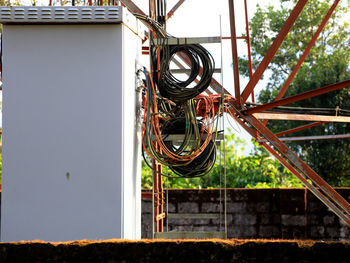 Low angle view of chain against building