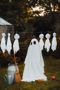 Rear view of a kid wearing ghost costume during halloween