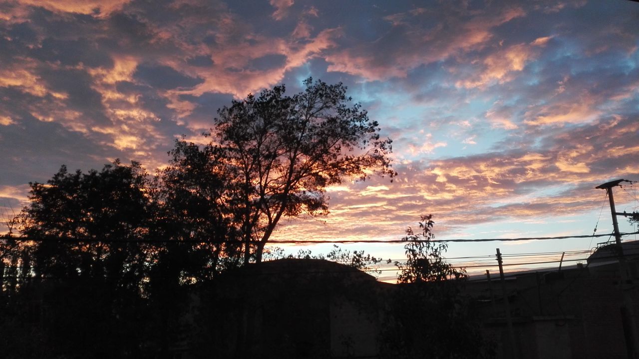 sky, sunset, silhouette, cloud - sky, tree, cloudy, tranquility, cloud, scenics, beauty in nature, tranquil scene, nature, built structure, bare tree, dramatic sky, low angle view, house, branch, orange color, idyllic