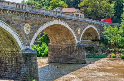 Arch bridge over river