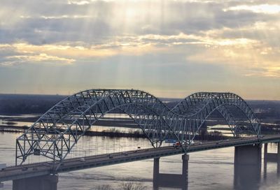 View of bridge over river against cloudy sky