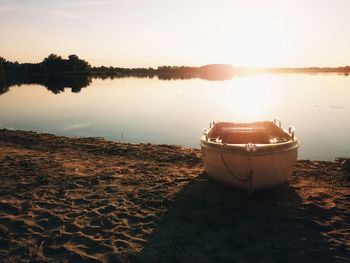 Scenic view of lake at sunset