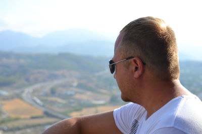 Close-up of man against sky