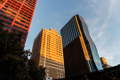 Low angle view of modern buildings against sky