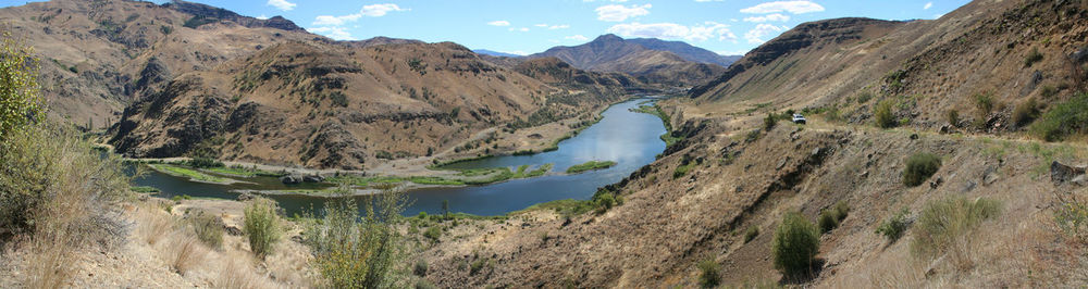 Panoramic view of lake and mountains against sky