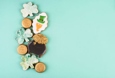 High angle view of candies on table against blue background