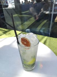 Glass of drink on table