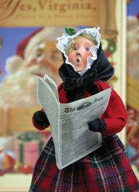 Portrait of cute boy holding paper