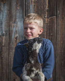 Portrait of boy on wood