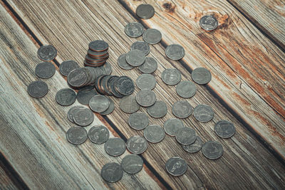 High angle view of coins on table