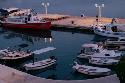 High angle view of boats moored at harbor