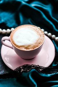 Close-up of cappuccino on table