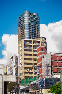 Low angle view of buildings against blue sky