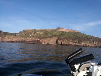 Scenic view of sea against blue sky