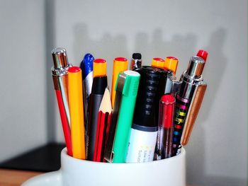 Close-up of multi colored pencils on table