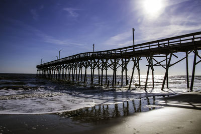 Bridge over sea against sky