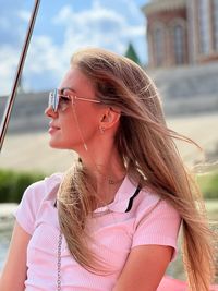 Portrait of young woman wearing sunglasses