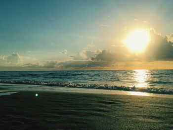 Scenic view of beach at sunset