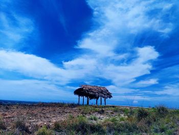 Scenic view of land against blue sky