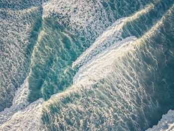 High angle view of water flowing in sea