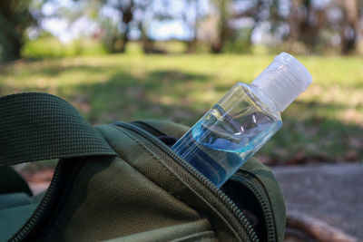 Close-up of man drinking water bottle