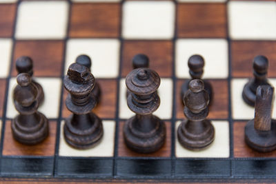 Close-up of chess pieces on white background