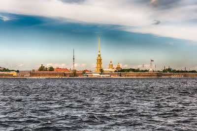 View of buildings against cloudy sky