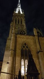 Low angle view of bell tower at night
