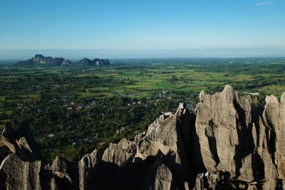 Panoramic view of rocks on land against sky