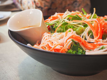 Close-up of chopped vegetables in bowl on table