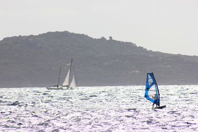 Sailboat sailing in sea