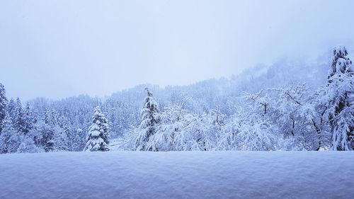 Scenic view of snowcapped mountains against clear sky