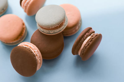 Close-up of macaroons against blue background