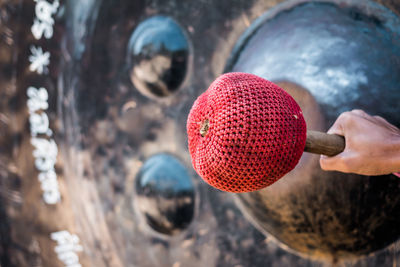 Close-up of hand holding strawberry