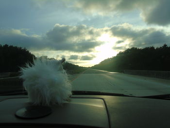 Road seen through car windshield