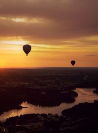 Hot air balloon flying over landscape