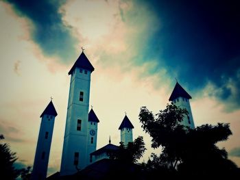 Low angle view of bell tower against sky