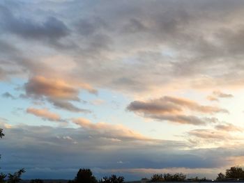 Low angle view of dramatic sky during sunset