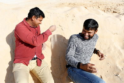Cheerful friends enjoying at desert
